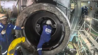 Technician performing onboard turbocharger repair aboard a marine vessel at UAE port
